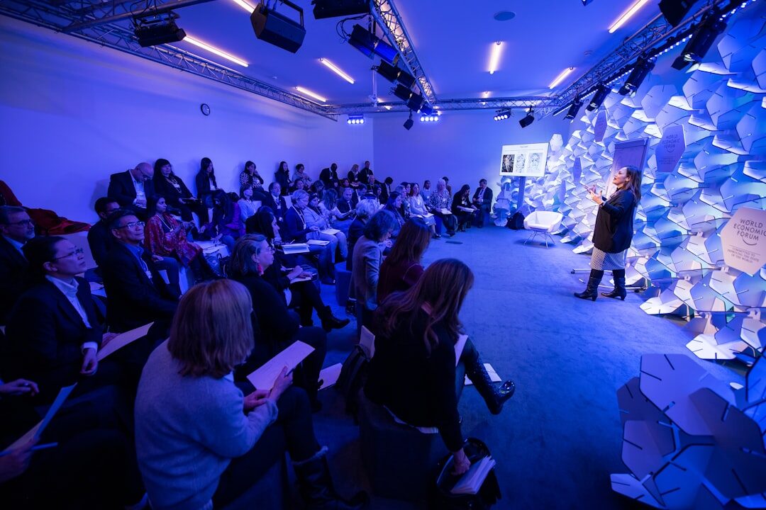 Professional moderating a business conference panel on stage