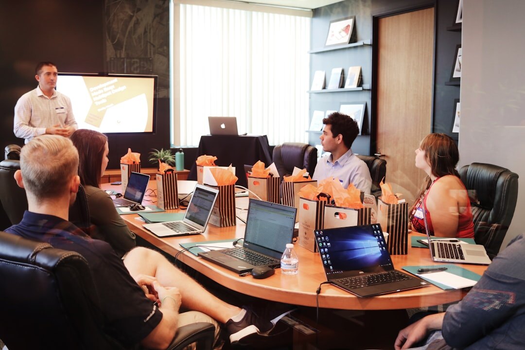 Team of professional trainers and educators collaborating in a meeting